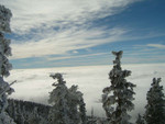 More clouds below the peak